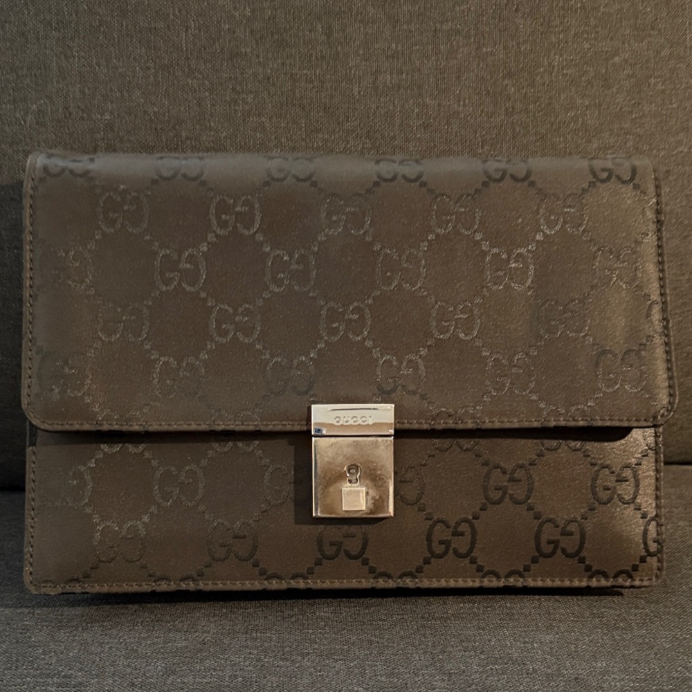 9. Gucci Dark Brown Monogram Clutch